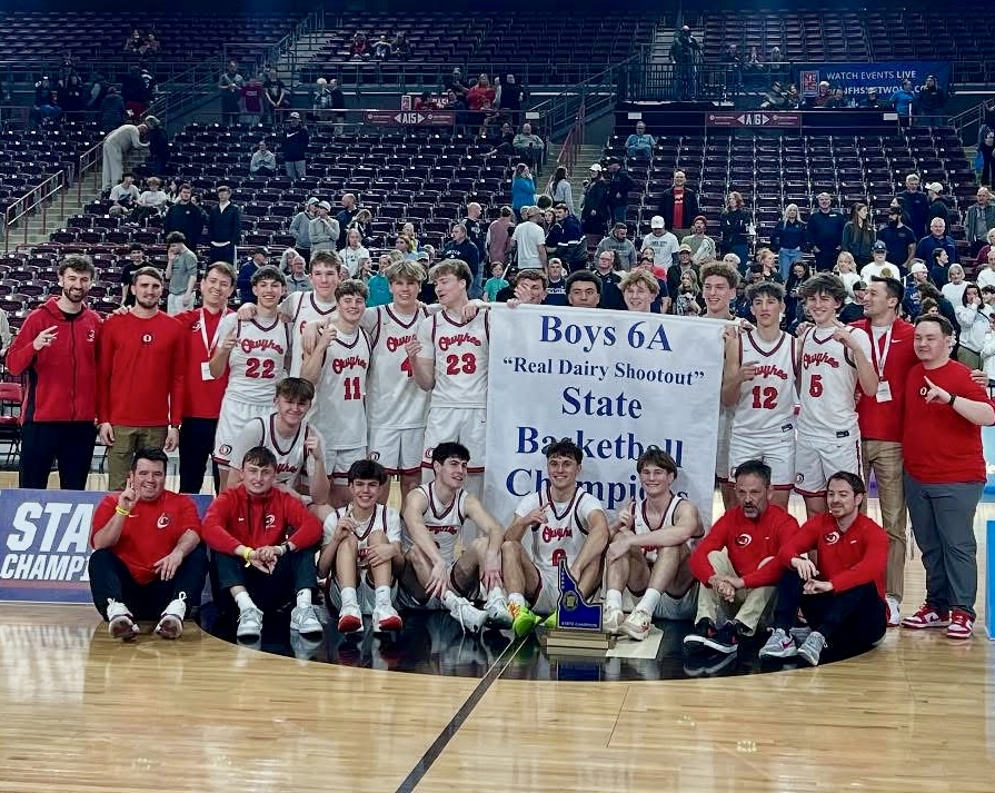 Owyhee High School Boys Basketball Team Holding 2025 6A Idaho State Championship Banner,   Photo Credit: Owyhee High School Facebook